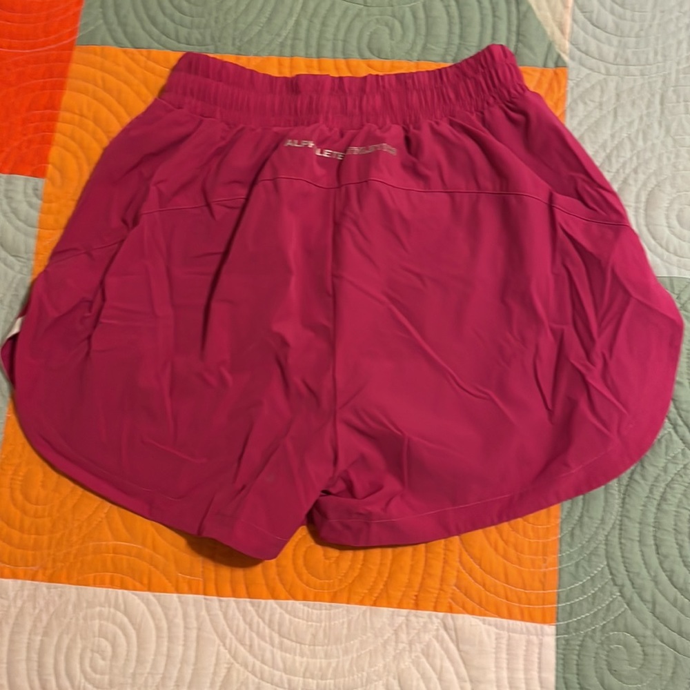 Alphalete 3” Stride Short In Arcade Pink View 2